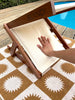 BLYND Premium Portable Beach Head Shade on towel with person pressing comfortable built-in pillow