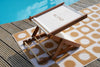 BLYND Premium Portable Beach Head Shade on towel near swimming pool sun shade.
